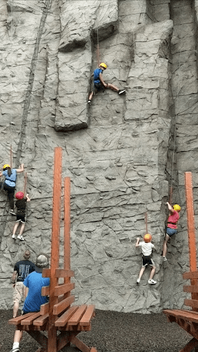 Kids climbing the rock wall