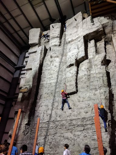Kid climbling the rock wall